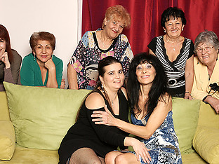 Old and young lesbians perform in a room full of mature ladies